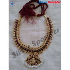 Traditional Temple jewellery churul(curl) Mango medium necklace with twin peacock pendant and pearl hangings.